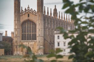 pexels photo 32783000 Stunning view of King's College Chapel in Cambridge, England, seen through foliage.